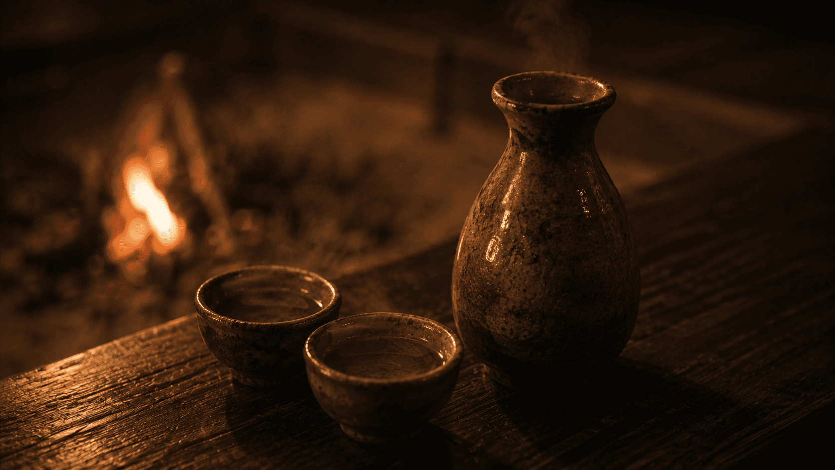 Sake flask warming beside the fire